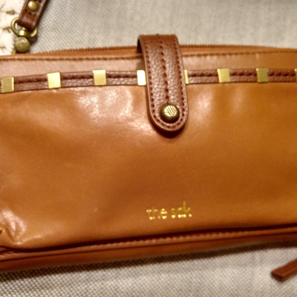 brown wallet with wrist strap